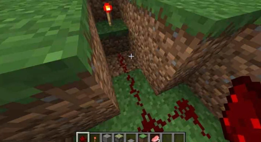 Rải bột đá đỏ và đặt đuốc Redstone vào rãnh ngầm